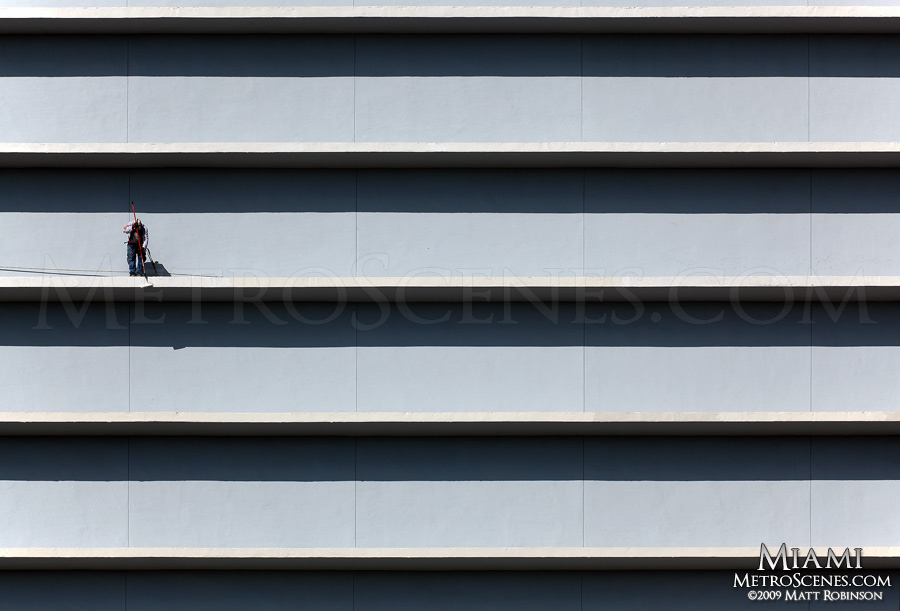 High rise painter on the edge