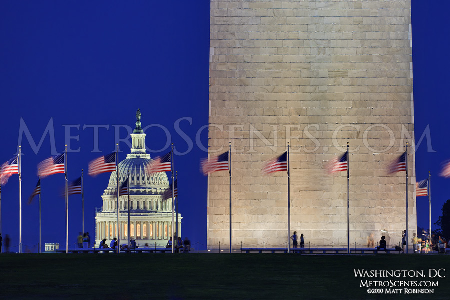 Base of the Washington Monument and US Capital dome at dusk